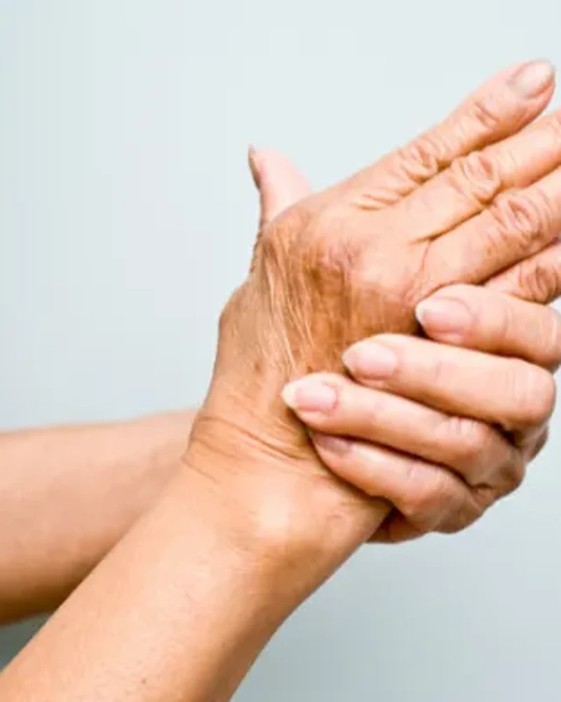 Therapist working with a patient on arthritis management exercises