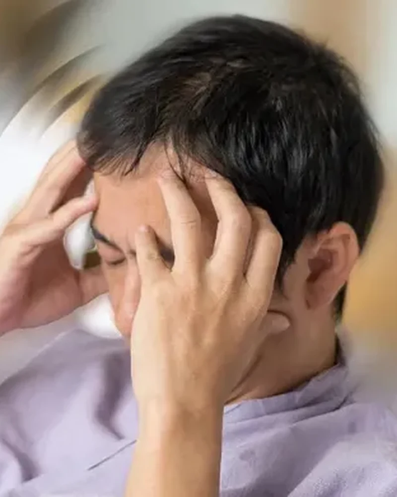 Therapist guiding a patient through vestibular rehabilitation exercises