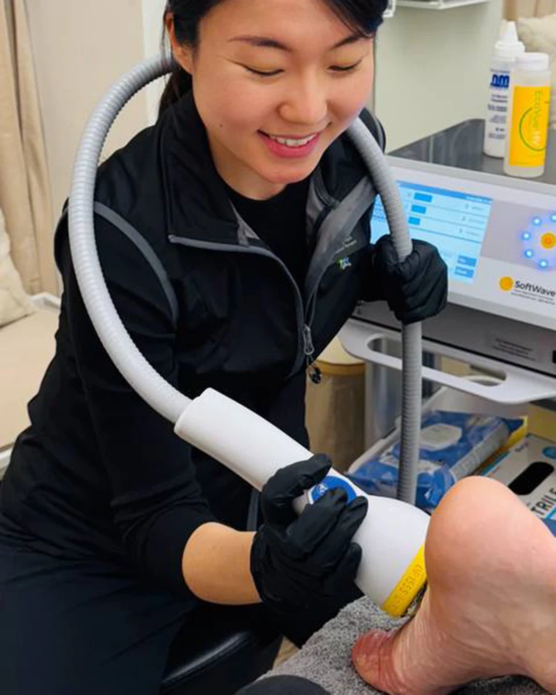 Therapist performing manual therapy on a patient's foot and ankle