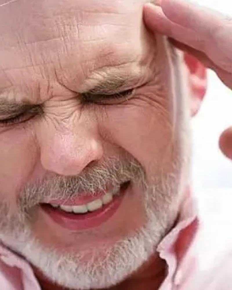 Therapist performing cervical manual therapy for headache relief