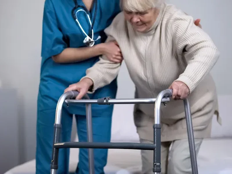 Physical therapist assessing hip range of motion after joint replacement