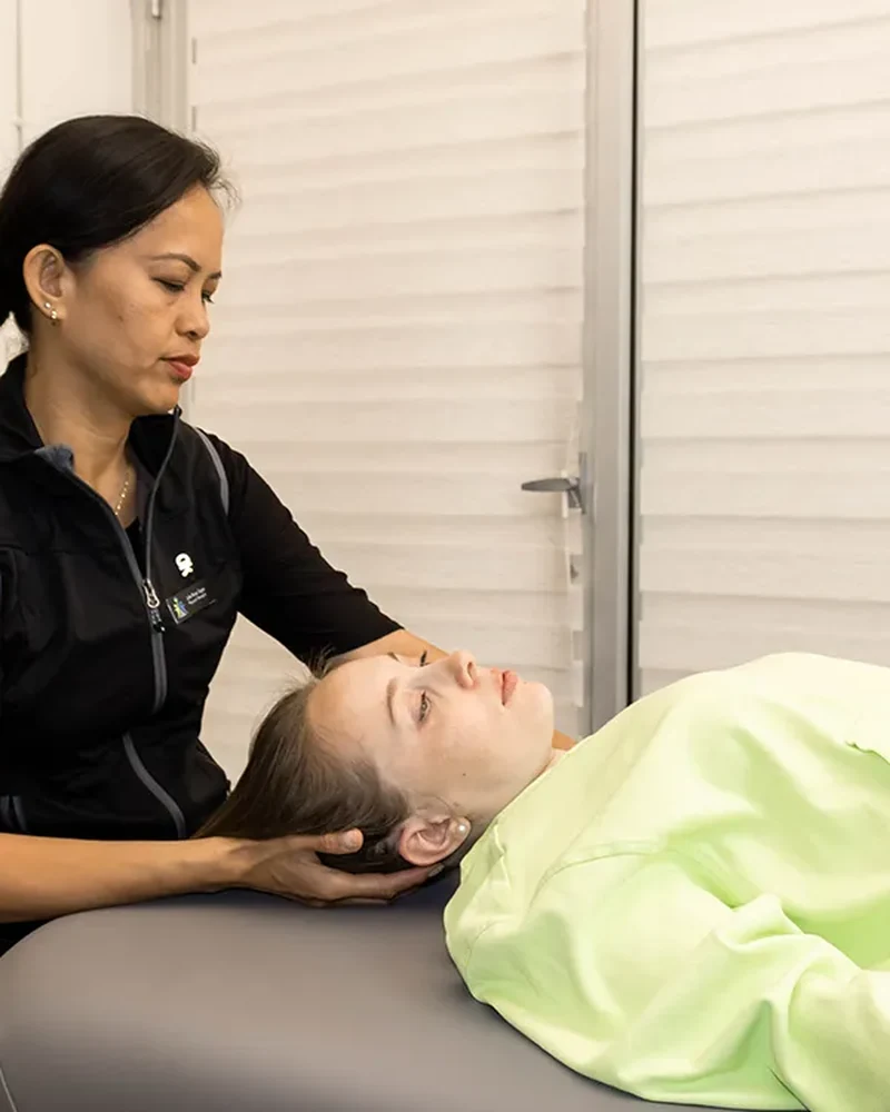 Therapist providing manual therapy for neck pain