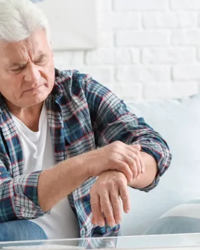 Therapist guiding a Parkinson's patient through movement exercises