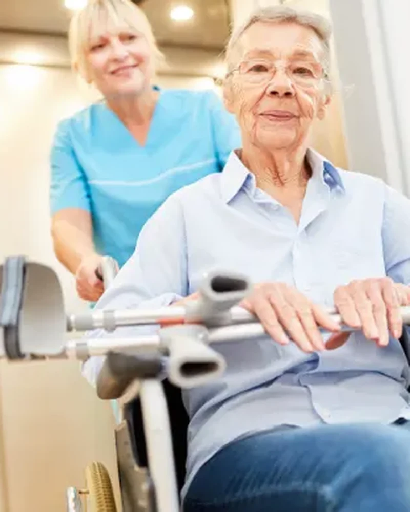 Therapist guiding a stroke patient through functional movement retraining