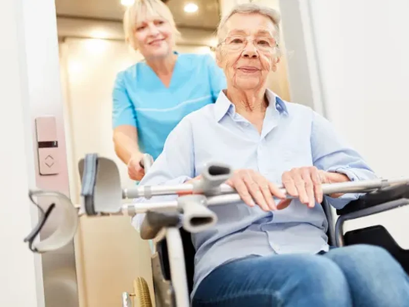 Physical therapist assisting a stroke patient with balance and movement