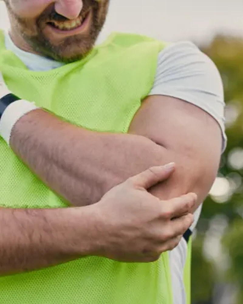 Therapist using manual techniques to treat a patient's tendinitis