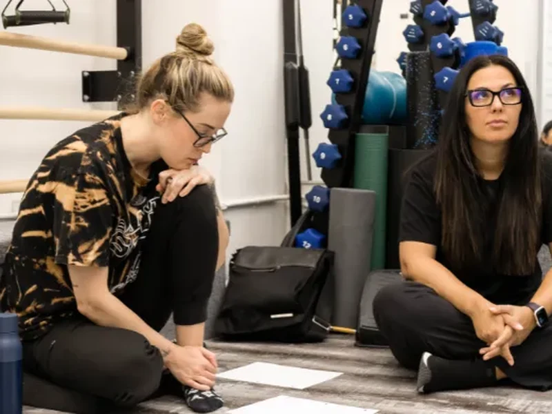 Physical therapists training in clinical Pilates instruction