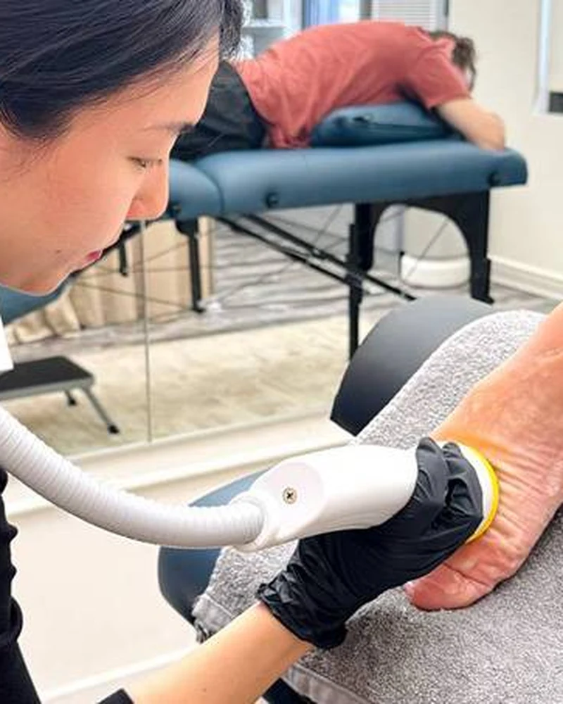 Therapist administering softwave shockwave treatment