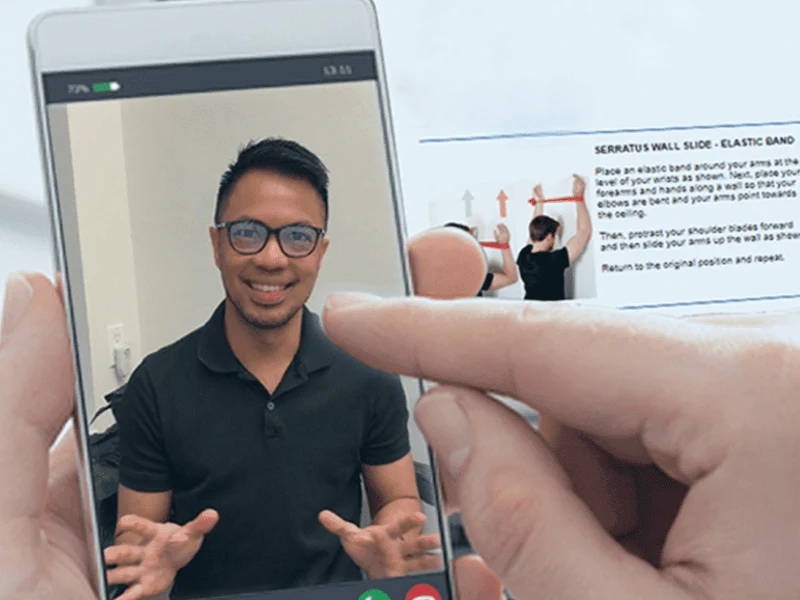 Patient attending a telehealth physical therapy session on a laptop