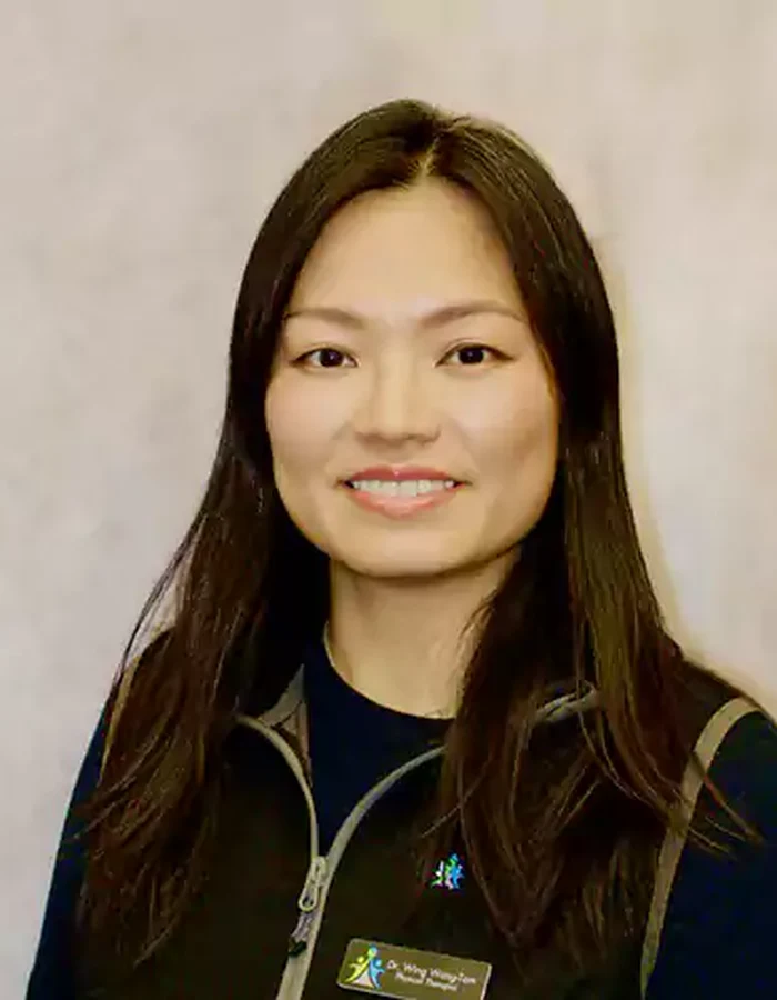 Dr. Wing M. Wong-Tom outside the clinic